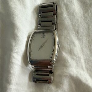 Women’s Movado Silver Watch with mother of pearl face. Will need new battery.